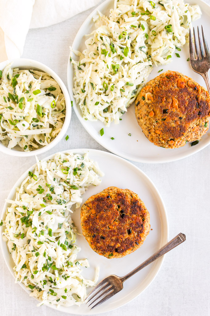 Easy Salmon Patties with Herby Slaw - These salmon patties are easy to make, perfect for a busy weeknight. Crispy on the outside, tender on the inside, they are served with a side of refreshing, crunchy herby coleslaw that you will love. #cannedsalmon #pantrystaples #coleslawrecipe #cabbage #weeknightmeal #30minutemeal #heatlthy #eggfreerecipe #glutenfreerecipe #dairyfreerecipe | robustrecipes.com