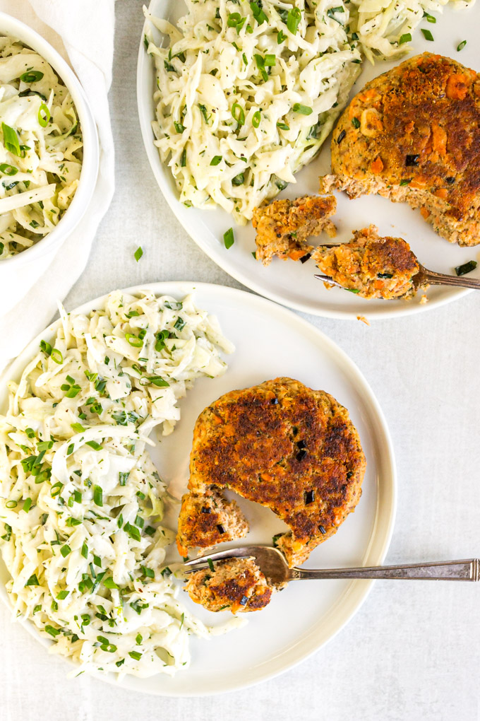Easy Salmon Patties with Herby Slaw - These salmon patties are easy to make, perfect for a busy weeknight. Crispy on the outside, tender on the inside, they are served with a side of refreshing, crunchy herby coleslaw that you will love. #cannedsalmon #pantrystaples #coleslawrecipe #cabbage #weeknightmeal #30minutemeal #heatlthy #eggfreerecipe #glutenfreerecipe #dairyfreerecipe | robustrecipes.com