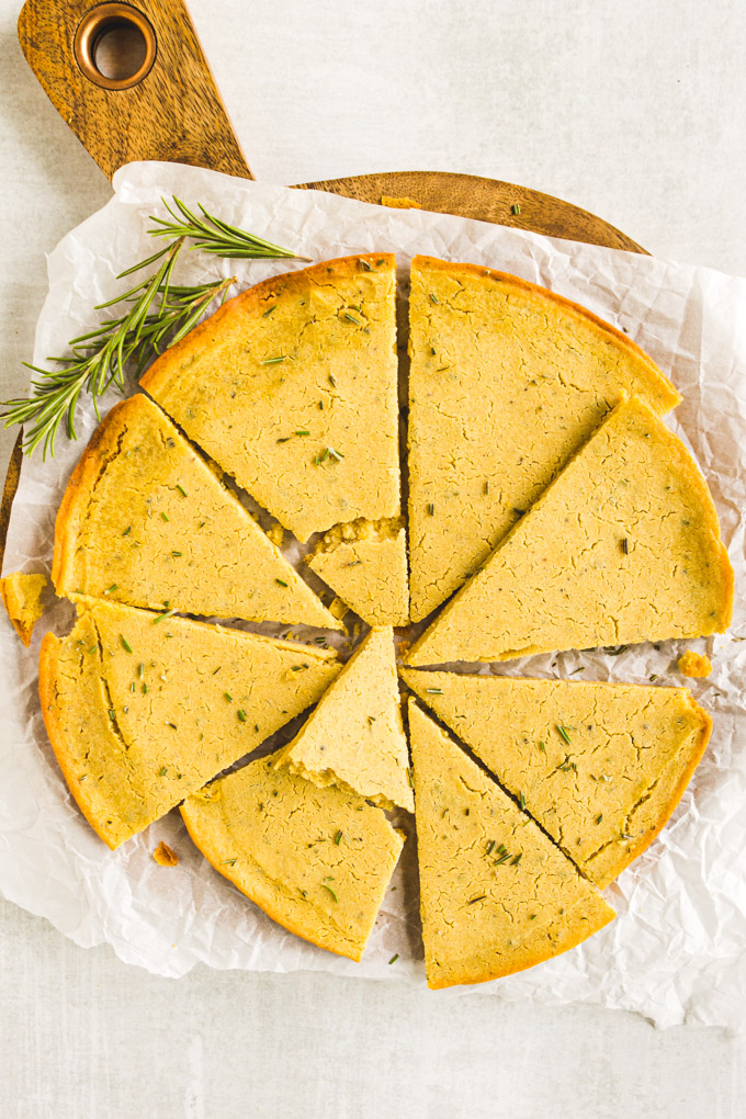 Rosemary Socca (Chickpea Flour Flatbread) - An easy flatbread that uses a few simple ingredients. No yeast, proof time, or kneading required. A delicious side dish or appetizer. #glutenfreerecipe #glutenfreebaking #breadrecipe #easybaking #veganrecipe #vegetarianrecipe #socca #chickpea | robustrecipes.com