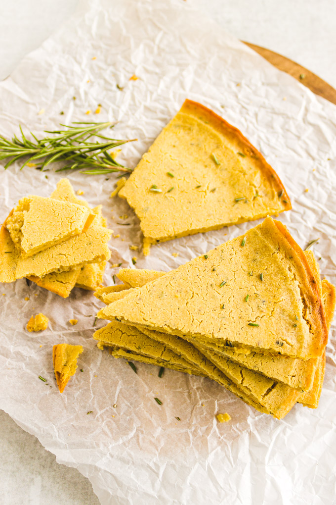 Rosemary Socca (Chickpea Flour Flatbread) - An easy flatbread that uses a few simple ingredients. No yeast, proof time, or kneading required. A delicious side dish or appetizer. #glutenfreerecipe #glutenfreebaking #breadrecipe #easybaking #veganrecipe #vegetarianrecipe #socca #chickpea | robustrecipes.com