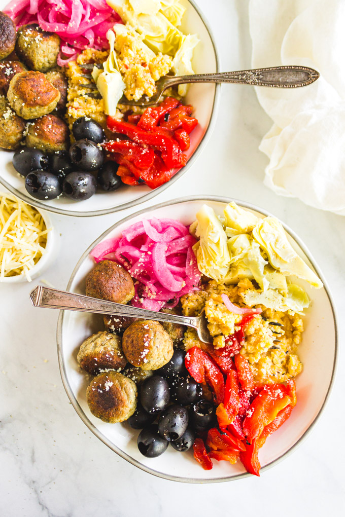 Italian Polenta Bowl - creamy polenta as the base of the bowl, and topped with meatballs, and a variety of Italian veggies. A quick and easy weeknight meal. #weeknightdinner #30minutemeals #glutenfreerecipe #Polenta #easyrecipe #ricottacheese #healthy | robustrecipes.com