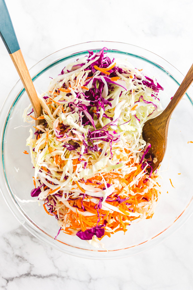 This classic creamy coleslaw recipe is the perfect make ahead side to any summertime meal or summer party. It's easy and only takes 20 minutes to make. Creamy dressing with plenty of crunchy cabbage. #coleslaw #cabbage #sidesalad #summerecipe #glutenfreerecipe | robustrecipes.com