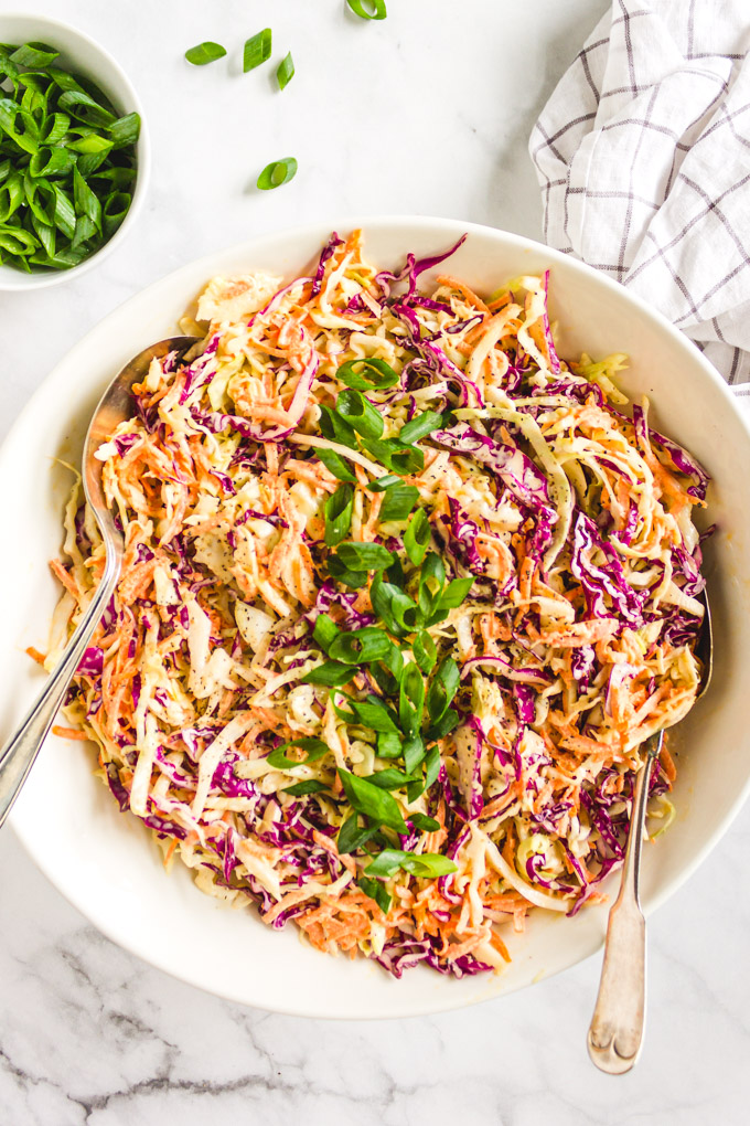 This classic creamy coleslaw recipe is the perfect make ahead side to any summertime meal or summer party. It's easy and only takes 20 minutes to make. Creamy dressing with plenty of crunchy cabbage. #coleslaw #cabbage #sidesalad #summerecipe #glutenfreerecipe | robustrecipes.com