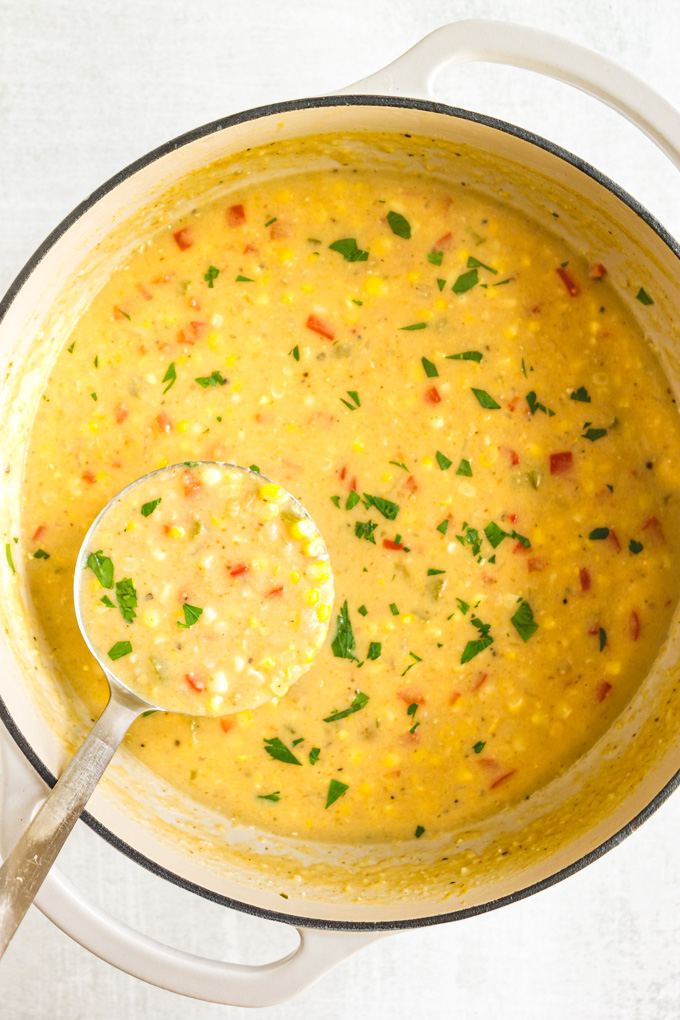 Homemade Corn Chowder - The perfect recipe to use up end-of-summer sweet corn in a way that will keep you warm on cold fall nights. Packed with sweet, crunchy corn, potatoes, and a thick, creamy broth this corn chowder is a seasonal favorite. #cornchowder #soupseason #souprecipe #cornonthecob #vegetarianrecipe #glutenfreerecipe #sidesoup #sidedish #fallrecipes #healthy | robustrecipe.com