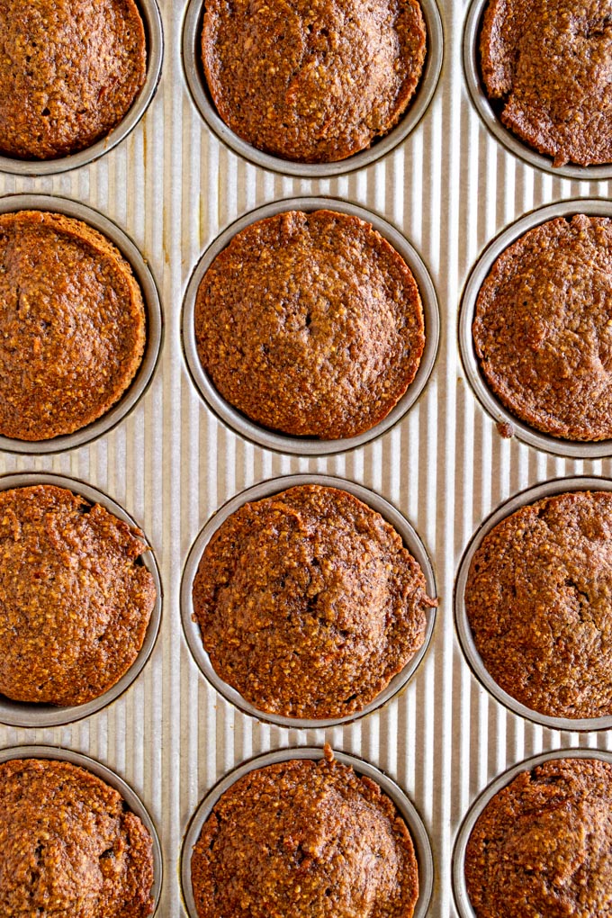 spiced carrot muffins baked into muffin tin.
