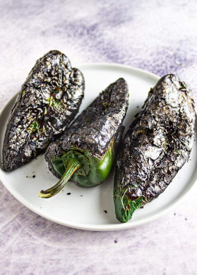 roasted poblano peppers on a white plate
