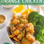 A bowl of orange chicken with broccoli and text overlay for Pinterest.
