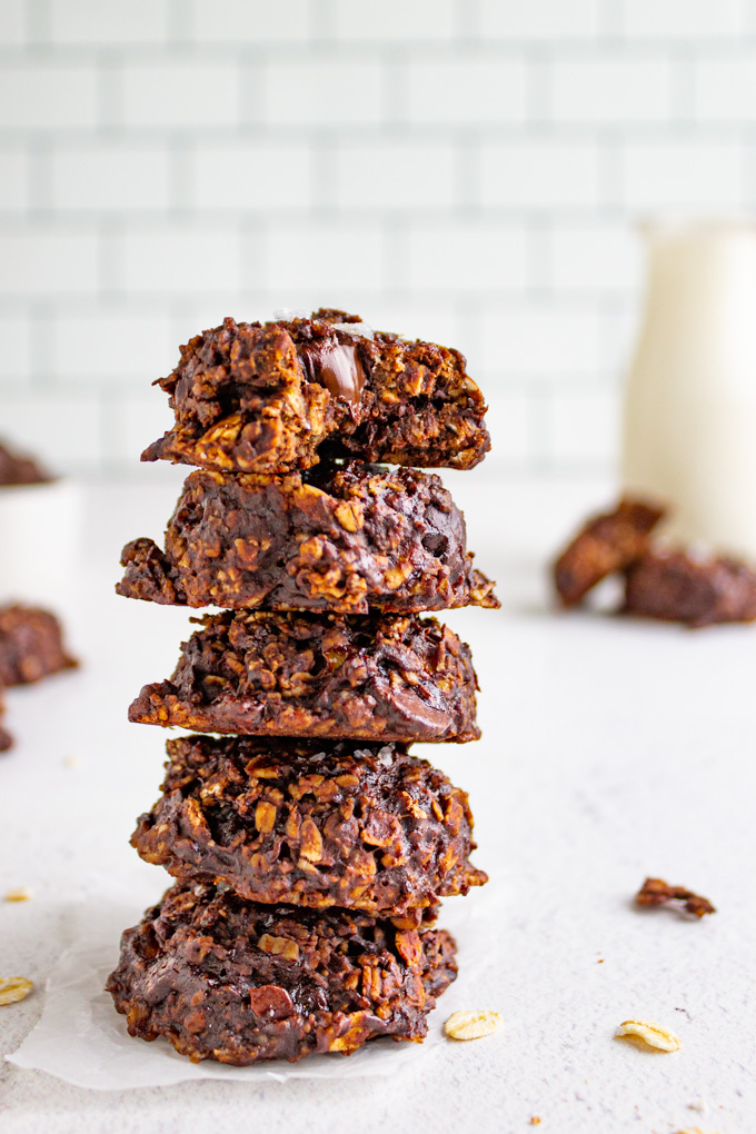 a stack of healthy chocolate oatmeal cookies on a white background.