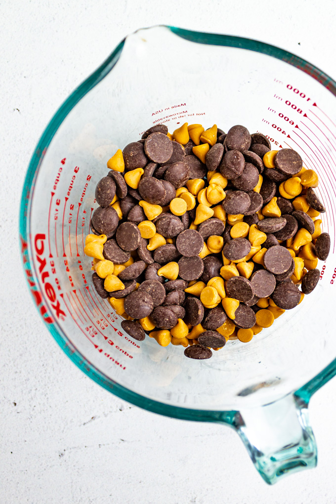 butterscotch chips and chocolate chips mixed together in a bowl.