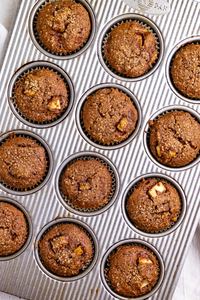 Overhead shot of Healthy apple butter muffins in a muffin pan.