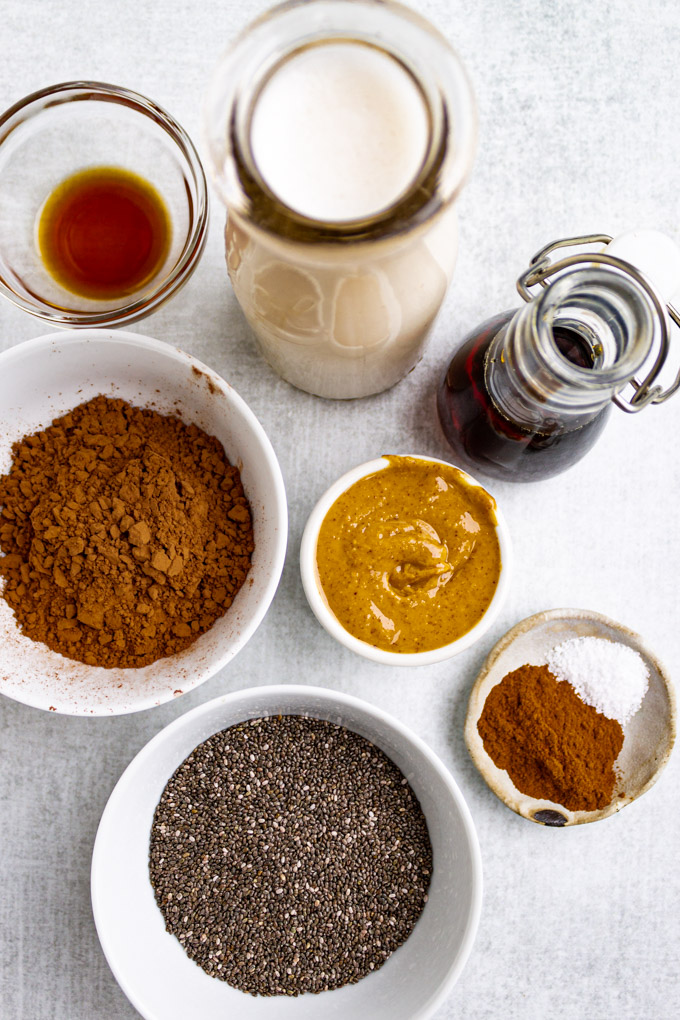 ingredients for chia pudding in separate bowls and containers.