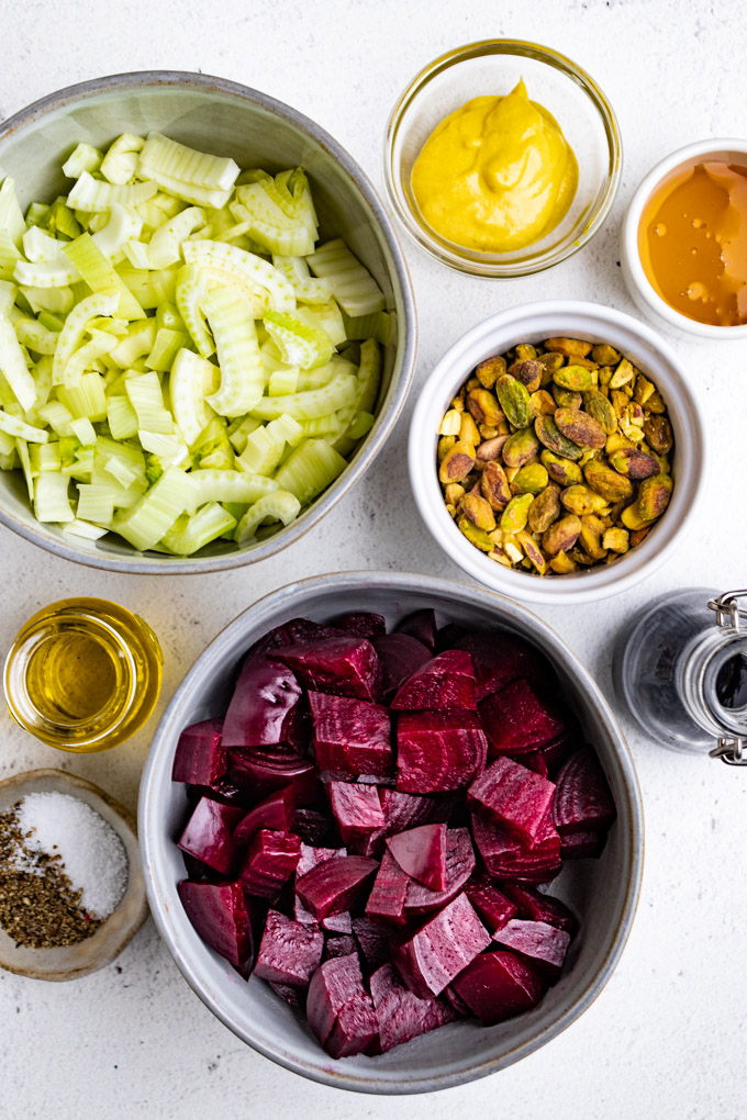 ingredients for beet and fennel salad, in separate gray bowls.