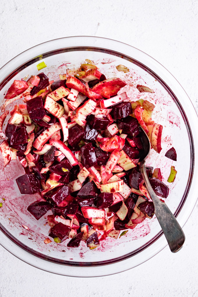 beet and fennel salad mixed together in a mixing bowl.