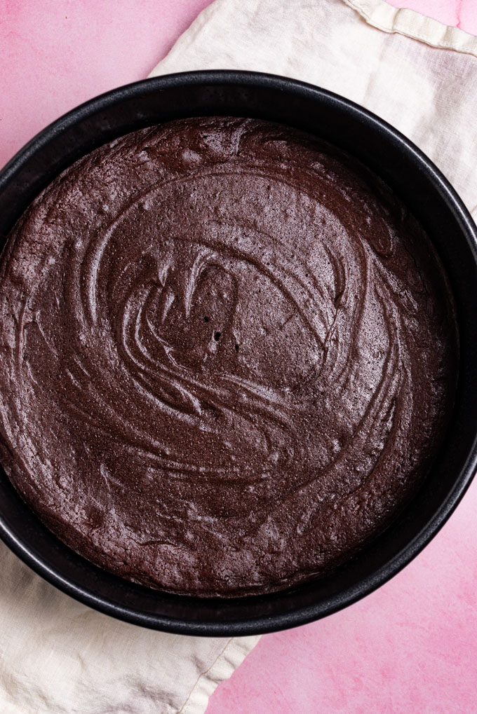 Flourless chocolate cake baked in a cake pan.